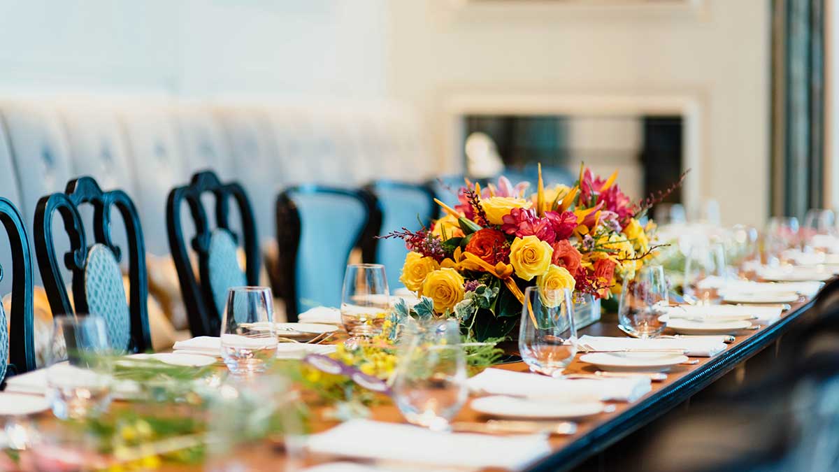 beautiful long event table with floral arrangements