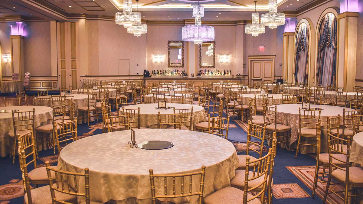 empty gala event room with banquet tables set up